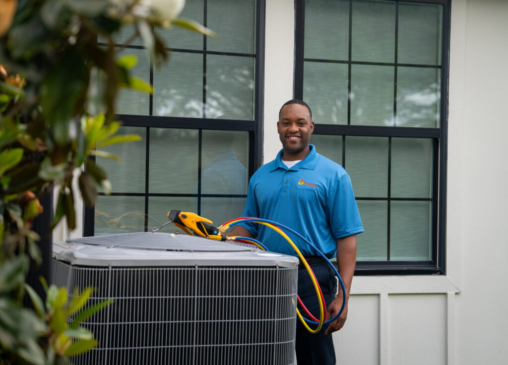 Smiling Air Conditioner Tech with Unit