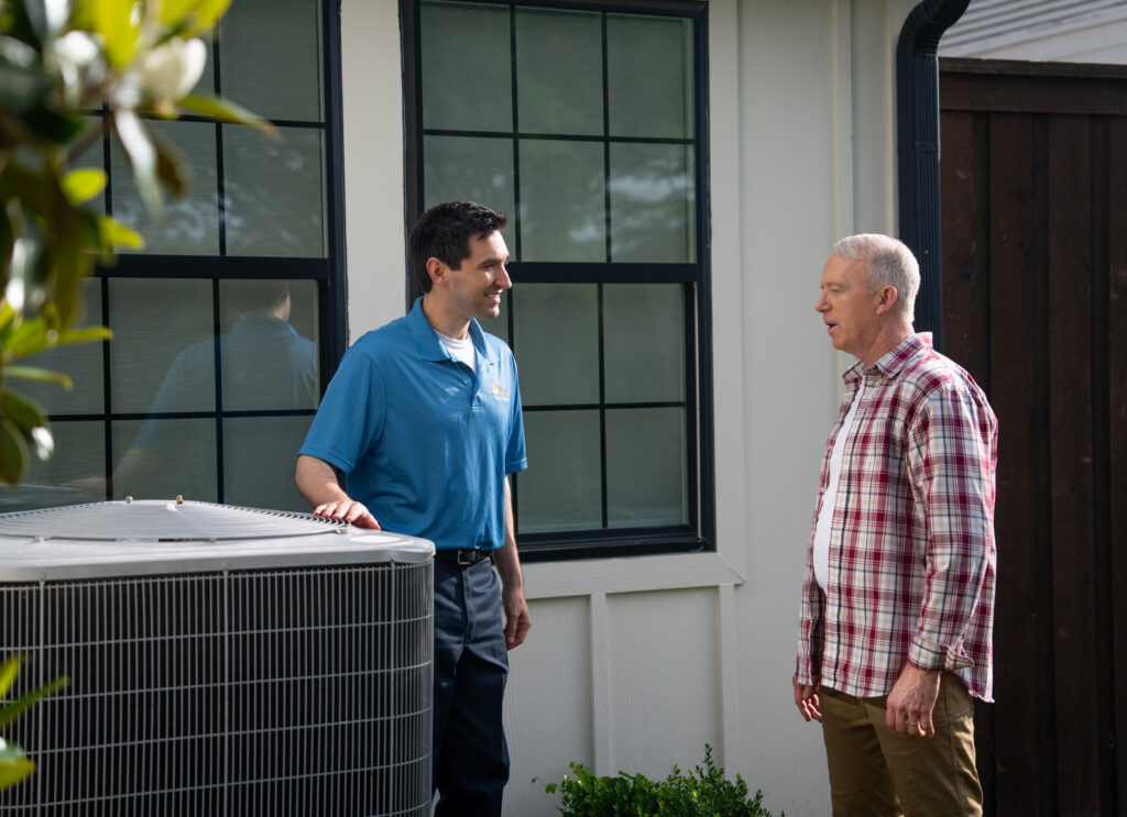 Ellington AC Technician Speaking with Customer