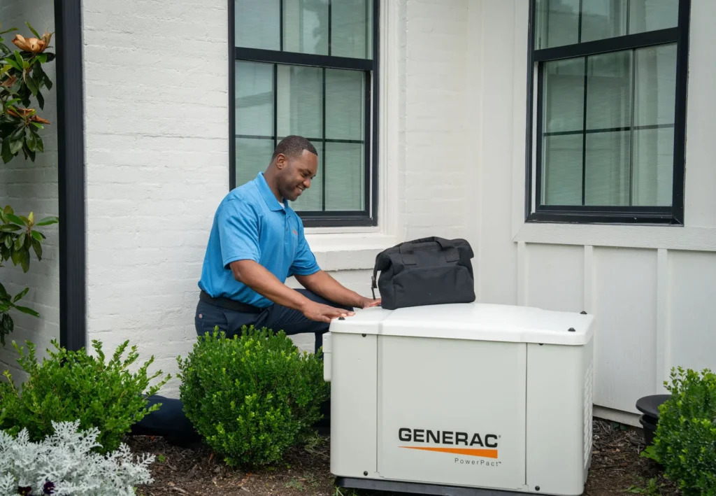 Technician servicing a home standby generator
